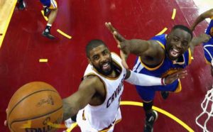 Kyrie Irving No.2 of the Cleveland Cavaliers drives to the basket against Draymond Green No.23 of the Golden State Warriors during the second half in Game 3 of the 2016 NBA Finals at Quicken Loans Arena on Thursday in Cleveland, Ohio.  AFP PHOTO 