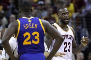 LeBron James No.23 of the Cleveland Cavaliers and Draymond Green No.23 of the Golden State Warriors exchange words during a time out during the fourth quarter in Game 4 of the 2016 NBA Finals at Quicken Loans Arena on Saturday in Cleveland, Ohio.  AFP PHOTO