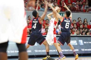 Letran’s Rey Nambatac and Felix Aprekuguard San Beda’s Dan Sara during Game 1 ofSeason 91 NCAA finals. FILE PHOTO