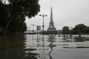 The River Seine bursting its banks next to the Eiffel Tower, in Paris, on June 2. Officials were putting up emergency flood barriers on June 2 along the swollen river after days of torrential rain—including near the Louvre, home to priceless works of art. AFP PHOTO