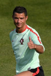 Portugal’s forward Cristiano Ronaldo gives a thumbs up during a training session at Portugal’s base                               camp in Marcoussis, on Friday, one day prior to the beginning of the Euro 2016 football tournament. AFP PHOTO