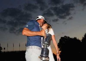 Dustin Johnson of the United States celebrates with partner Paulina Gretzky after winning the U.S. Open at Oakmont Country Club on Monday in Oakmont, Pennsylvania. AFP PHOTO