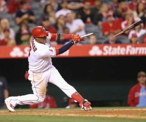 Yunel Escobar of the Los Angeles Angels of Anaheim breaks his bat as he hits a walk off RBI single in the ninth inning against the Cleveland Indians at Angel Stadium of Anaheim in California. AFP PHOTO 