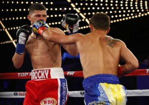 Vasyl Lomachenko (right) lands a left punch to the face of Roman Martinez during their Junior Lightweight WBO World Championship bout at the Theater at Madison Square Garden in New York City.  AFP PHOTO