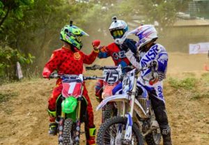 Glenn Aguilar gave a fist bump after a challenging round with Ralph Ramento (15) and Enzo Rellosa (24) during the 2016 Diamond Motocross Series. CONTRIBUTED PHOTO