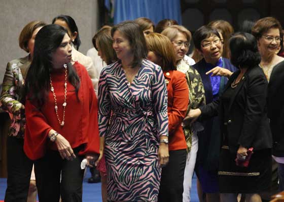 Camarines Sur Rep. Leni Robredo, the vice president-elect, talks to a colleague on the last day of session at the House of Representatives. The House leadership gave recognition to the lawmakers who will be bowing out on June 30. PHOTO BY RUY MARTINEZ