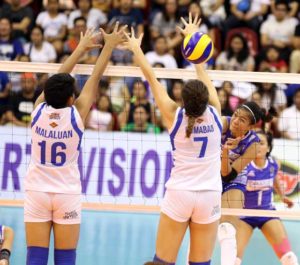 BaliPure’s Alyssa Valdez (right) hammers in a kill against Pocari Sweat’s Michele Gumabao (No. 7) and Lutgarda Malaluan during their Shakey’s V-League showdown before a huge crowd at the Philsports Arena on Saturday.  CONTRIBUTED PHOTO