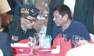 WHAT’S THE PLAN? President Rodrigo Duterte chats with former President Fidel Ramos during the testimonial dinner organized by the San Beda Law Almni Association at Club Filipino in San Juan City. Duterte wants Ramos to open the bilateral talks with China. CONTRIBUTED PHOTO