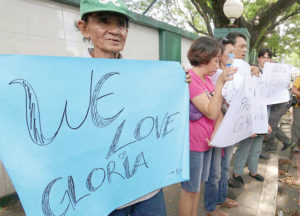WAITING Supporters of former President Gloria Macapagal-Arroyo gather outside the Veterans Memorial Medical Center in Quezon City on Wednesday to await her release. The Supreme Court on Tuesday acquitted Arroyo, now a Pampanga representative, of plunder, but her release papers are yet to be issued. PHOTO BY RUY L. MARTINEZ 