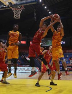 Laurenz Victoria of Mapua battles for ball against Justine Mercado of San Sebastian during a National Collegiate Athletic Association Season 92 men’s basketball game at The Arena in San Juan City on Friday.  PHOTO BY RUSSEL PALMA