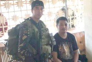 CAUGHT Road rage suspect Vhon Tanto is shown at Army station in Masbate after his arrest on Friday. 