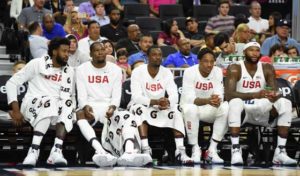 DeAndre Jordan No.6, Kevin Durant No.5, Harrison Barnes No.8, DeMar DeRozan No.9 and DeMarcus Cousins No.12 of the United States look on from the bench during a USA Basketball showcase exhibition game against Argentina at TMobile Arena on July 22, in Las Vegas, Nevada. The United States won 111-74.