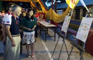 US Ambassador Philip Goldberg checks out the posters drawn by students portraying friendship in their community