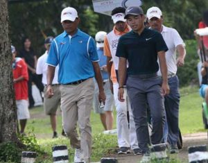 Frankie Minoza and Miguel Tabuena walk their way off No. 4 with the latter wresting a two-stroke lead in the early going of the final round. CONTRIBUTED PHOTO