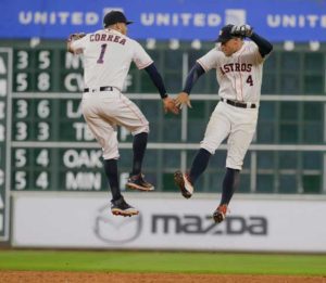 Carlos Correa No.1 of the Houston Astros and George Springer No.4 celebrate after beating he Seattle Mariners 9-8 at Minute Maid Park on Thursday in Houston, Texas.  AFP PHOTO