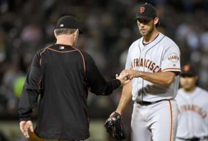 Manager Bruce Bochy No.15 of the San Francisco Giants takes the ball from starting pitcher Madison Bumgarner No.40 taking him out of the game against the Oakland Athletics in the bottom of the seventh inning at O.co Coliseum on Friday in Oakland, California. AFP PHOTO