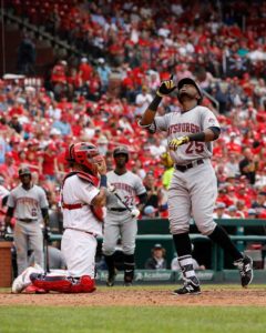 Yadier Molina No.4 of the St. Louis Cardinals looks on as Gregory Polanco No.25 of the Pittsburgh Pirates crosses home plate after hitting his second home run of the game during the eighth inning at Busch Stadium on Tuesday in St. Louis, Missouri.  AFP PHOTO