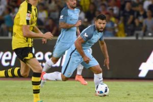 Manchester City’s Sergio Aguero (right) controls the ball during the 2016 International Champions Cup football match between Manchester City and Borussia Dortmund in Shenzhen, south China’s Guangdong province on Friday. AFP PHOTO