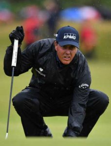 US golfer Phil Mickelson lines up a putt on the 13th green during his second round on day two of the 2016 British Open Golf Championship at Royal Troon in Scotland on Saturday. The second round got underway at on Friday morning, with expectations for far more trying conditions at Royal Troon. AFP PHO