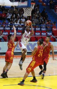 Emilio Aguinaldo College’s Sidney Onwubere attempts a lay-up past San Sebastian’s players Ian Valdez (22), Chester Serajosef (12) and Alvin Baetiong during an NCAA Season 92 men’s basketball game at The Arena in San Juan City on Friday. PHOTO BY RUSSELL PALMA 