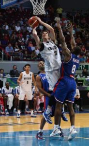 Thomas Ambercrombie of New Zealand attempts to shoot through the defense of Tony Parker and Charles Kahudi of France during the 2016 FIBA Olympic Qualifying Tournament at the SM Mall of Asia Arena in Pasay City. Photo by Russell Palma 