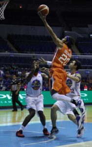 Jared Dillinger of Meralco Drives on Moala Tautuaa and Larry Fonacier of Talk and Text During a PBA Governor’s Cup game at Araneta Coliseum in Cubao Quezon City.   PHOTO BY RUSSEL PALMA 