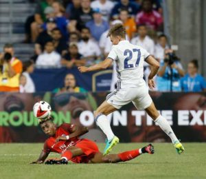 Presnel Kimpembe No.3 of Paris Saint-Germain F.C attempts to steal the ball from Marcos Llorente No.27 of Real Madrid C.F. during the second half on Thursday at Ohio Stadium in Columbus, Ohio. AFP PHOTO