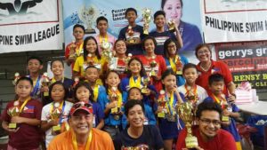 Philippine Swimming League (PSL) President Susan Papa with champion team coaches Ahli Frigillana, Joey Andaya and Edwin Valdez, and the Most Outstanding Swimmers in the 97th PSL National Series - Top 16 Swimming Championship.  CONTRIBUTED PHOTO