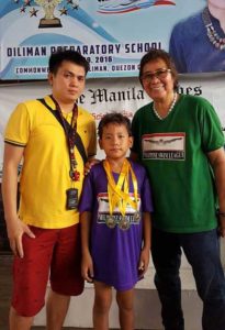 Record-breaker Aishel Cid Evangelista of Aquaspeed Sailfish (center) displays his medals with Philippine Swimming League President Susan Papa (right) and Aquaspeed Sailfish coach Ryan Robles. CONTRIBUTED PHOTO