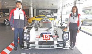 Mary Ann “MeAnne” Espinosa (right), a sales consultant at Porsche Center Philippines, is among the world’s top 100 sales executives. Together in photo is Porsche Philippines president Roberto Coyiuto III.