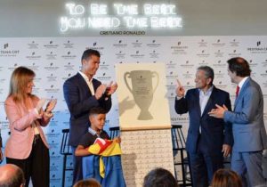 Portuguese forward Cristiano Ronaldo (second left) applauds beside his son Cristiano Ronaldo Jr. in front of the owner and chairman of Pestana Hotel Group, Dionisio Pestana (second right) and the regional president of Madeira, Miguel Albuquerque (right) during the opening of the Pestana CR7 Hotel in Funchal, on Madeira island on Saturday. AFP PHOTO