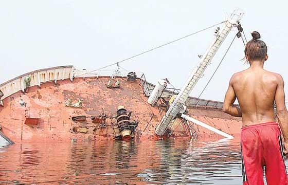 Cargo vessel MV Captain Ufuk sinks on Manila Bay after sea water got inside the ship on Saturday night. In 2009, the ship was apprehended by the Bureau of Customs for smuggling high-powered firearms. PHOTO BY RUSSELL PALMA