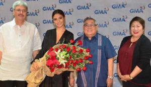 They all love Lovi! (From left) GMA EVP and CFO Felipe Yalong, Poe, network Chairman and CEO Felipe Gozon, Senior Vice President for Entertainment TV Lilybeth Rasonable 