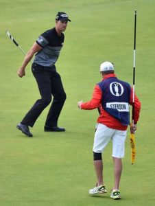 Winner, Sweden’s Henrik Stenson (left) and his caddie Garath Lord react as Stenson makes his birdie putt on the 18th green during his final round, shooting 63 in his final round to win the Championship by three shots, on day four of the 2016 British Open Golf Championship at Royal Troon in Scotland on Monday. AFP PHOTO