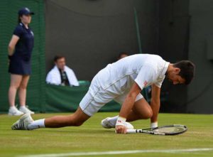 Serbia’s Novak Djokovic slips as he plays US player Sam Querrey during their men’s singles third round match on the fifth day of the 2016 Wimbledon Championships at The All England Lawn Tennis Club in Wimbledon, southwest London. AFP PHOTO