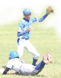 South Korean Kim Jin Min forces Christian Patrick Delos Reyes of Philippines-B out during the 2016 Pony Baseball International Asia Pacific Zone Championship at the Alabang Country Club in Muntinlupa City.  Photo by RENE  H. DILAN