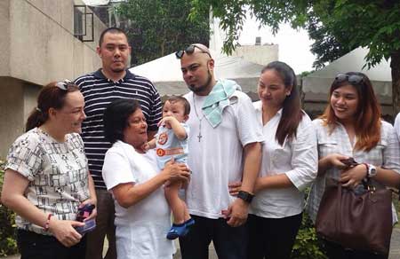 Nora Aunor cuddles her first real blood grandson, Jaden, son of Ian de Leon PHOTO FROM FACEBOOK/ ANNA MARIE ABU AND EVELYN LAMAGNA