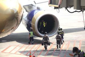 Aircraft technicians examine the engine of Gulf Air GF155.  PHOTO BY BENJIE L. VERGARA