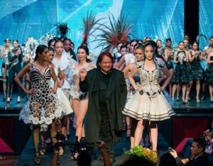  Designer Rocky Gathercole proudly walks the runway  with his creations