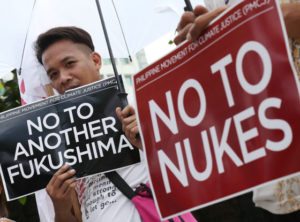 NO NUKES Members of the Philippine Movement for Climate Justice on Tuesday say no to nuclear energy as a power source at a protest rally in Manila, citing the Fukushima incident in Japan. The protest came as the Energy department said it is looking at the viability of nuclear technology to sustain the country’s electrification program. PHOTO BY RENE H. DILAN 