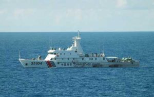 Chinese coast guard ship 35104 sails near the waters of disputed East China Sea islands on Saturday. Japan Coast Guard on Saturday confirmed some 230 Chinese fishing vessels and six coast guard ships, including three apparently carrying arms, were sailing near the waters of disputed East China Sea islands, the government said. AFP PHOTO/JAPAN COAST GUARD