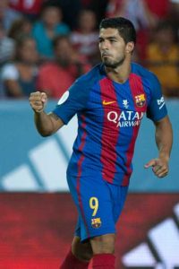 Barcelona’s Uruguayan forward Luis Alberto Suarez celebrates after scoring during the first leg of the Spanish Supercup football match between Sevilla FC and FC Barcelona at the Ramon Sanchez Pizjuan stadium in Sevilla on Monday. AFP PHOTO