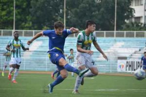 Global FC ace Misagh Bahadoran drives the ball through the defense of Nomads FC during a first round game of the United Football League. PHOTO BY JAELLE NEVIN REYES