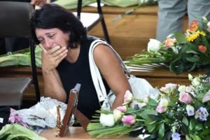 UNSPEAKABLE GRIEF A woman mourns next to the coffin of an earthquake victim, in a gymnasium arranged in a chapel of rest on Saturday, in Ascoli Piceno, three days after a 6.2-magnitude earthquake struck the region killing some 281 people. AFP PHOTO