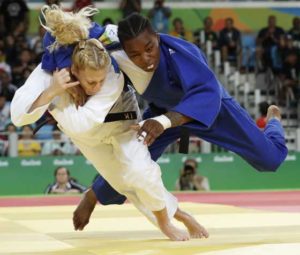 France’s Audrey Tcheumeo (right) competes with US Kayla Harrison during their women’s -78kg judo contest gold medal match of the Rio 2016 Olympic Games in Rio de Janeiro on Friday.   AFP PHOTO