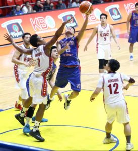 Kent Salado (16) of Arellano U attempts to score against Sidney Onwubere (1) of EAC during a National Collegiate Athletic Association  Season 92 men’s basketball  game Arena in San Juan City.    PHOTO BY BOB DUNGO Jr.