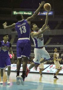 Manny Pacquiao of the Stalwarts attempts a lay-up as Maverick Ahanmisi (13) of the Greats stands guard during the Blitz game of the PBA All Star Weekend on Friday at the Araneta Coliseum. PHOTO BY BOB DUNGO JR.