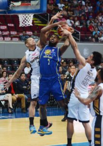 Bradwyn Guinto (5) of Mahindra blocks the shot of Moala Tautuaa (7) during the 2016 PBA Philippine Cup elimination round at the Mall of Asia Arena. Photo By Russell Palma 