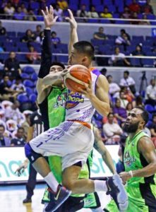 Talk ‘N Text’s guard Kris Rosales drives hard on Joseph Yeo of GlobalPort as Stanley Pringle looks on during a PBA Season 41 Governors’ Cup game at the Araneta Coliseum on Wednesday. CONTRIBUTED PHOTO