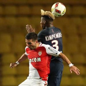 Monaco’s Portuguese midfielder Joao Moutinho (left) vies with Paris Saint-Germain’s French defender Presnel Kimpembe during the French Ligue 1 football match Monaco (ASM) versus Paris-Saint-Germain (PSG) on August 28, 2016 at the Louis 2nd Stadium in Monaco. AFP PHOTO